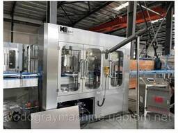 Автоматична лінія для наповнення та закривання банок ЖБ банок