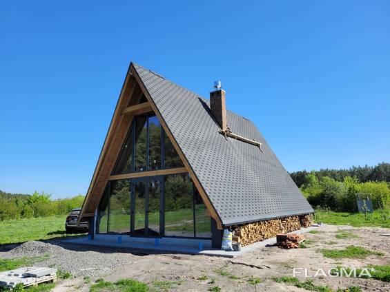 Будівництво капітального будинку альпійське шале 100 кв. м. на ділянці замовника