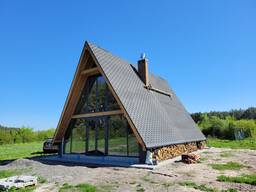 Будівництво капітального будинку альпійське шале 100 кв. м. на ділянці замовника