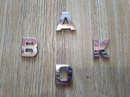 Пластмассовые буквы на авто A. D. K. B