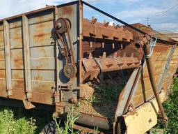 Прицеп кормораздатчик