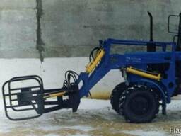 Захват для рулонов и тюков сена, соломы на погрузчик.