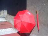 Зонт красного цвета от дождя и солнца